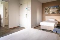 Postel nebo postele na pokoji v ubytování Fletcher Kloosterhotel Willibrordhaeghe