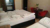 Postel nebo postele na pokoji v ubytování Hotel Kiwi