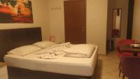 Postel nebo postele na pokoji v ubytování Hotel Kiwi
