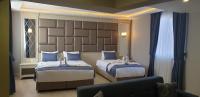 Postel nebo postele na pokoji v ubytování Martinenz Hotel