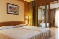 Postel nebo postele na pokoji v ubytování Hotel Guitart Central Park Aqua Resort