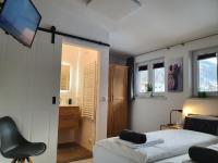 Łóżko lub łóżka w pokoju w obiekcie Alpen Appartements Viehhofen - incl Sommercard Zell am See Viehhofen