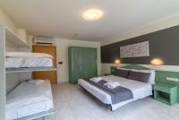 Łóżko lub łóżka w pokoju w obiekcie Hotel Airone