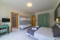 Łóżko lub łóżka w pokoju w obiekcie Hotel Airone