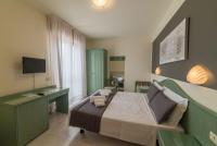 Łóżko lub łóżka w pokoju w obiekcie Hotel Airone