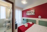 Łóżko lub łóżka w pokoju w obiekcie Hotel Airone