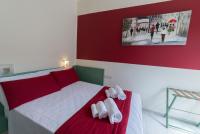 Łóżko lub łóżka w pokoju w obiekcie Hotel Airone