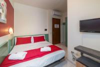 Łóżko lub łóżka w pokoju w obiekcie Hotel Airone