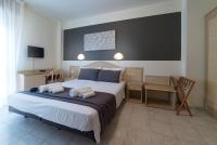 Łóżko lub łóżka w pokoju w obiekcie Hotel Airone