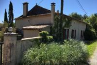 a white house with a fence in front of it at Maison de charme confortable au cœur de la nature in Saint-André-de-Double