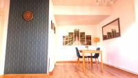 a dining room with a table and chairs at Studio de charme en plein centre ville in Beauvais