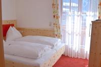 Łóżko lub łóżka w pokoju w obiekcie Pension Hochkönigblick