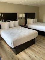 Ein Bett oder Betten in einem Zimmer der Unterkunft South Padre Island Lodge