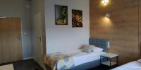 Łóżko lub łóżka w pokoju w obiekcie Hotel 107