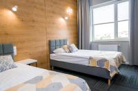 Łóżko lub łóżka w pokoju w obiekcie Hotel 107