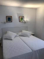A bed or beds in a room at Apartamentos Vista Vedrá