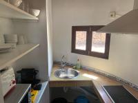 A kitchen or kitchenette at Apartamentos Vista Vedrá