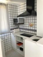 A kitchen or kitchenette at Apartamentos Vista Vedrá