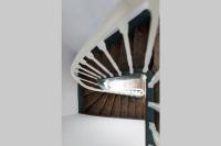 a spiral staircase in a house at La Villa de l&#39;Etoile jacuzzi privé chauffé à 37°C in Forges-les-Eaux