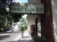 una señal para un hotel escondido en el lado de un edificio en Hotel Español Salto, en Salto