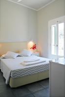 Posteľ alebo postele v izbe v ubytovaní Zefiros Traditional Hotel