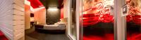 Łóżko lub łóżka w pokoju w obiekcie Pineta Hotel