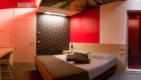 Łóżko lub łóżka w pokoju w obiekcie Pineta Hotel