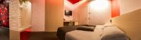 Łóżko lub łóżka w pokoju w obiekcie Pineta Hotel