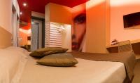 Łóżko lub łóżka w pokoju w obiekcie Pineta Hotel
