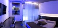 Łóżko lub łóżka w pokoju w obiekcie Pineta Hotel