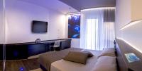 Telewizja i/lub zestaw kina domowego w obiekcie Pineta Hotel
