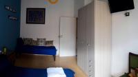 Posteľ alebo postele v izbe v ubytovaní B&B Bibliotechina