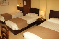 Postel nebo postele na pokoji v ubytování Rea Hotel