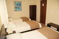 Postel nebo postele na pokoji v ubytování Rea Hotel