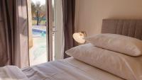 Postel nebo postele na pokoji v ubytování Ferienhaus Rovinj mit Pool