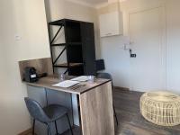 an office with a desk with two chairs and a table at Studio plein coeur de Nice 24 24H 7 7J in Nice