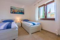 Posteľ alebo postele v izbe v ubytovaní Apartment in Crikvenica 34973