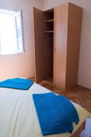 Postel nebo postele na pokoji v ubytování Apartment Banjol 10