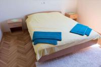 Postel nebo postele na pokoji v ubytování Apartment Banjol 10