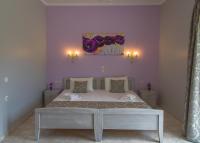 Postel nebo postele na pokoji v ubytování Villa Perkemes Apartments Parga