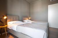 A bed or beds in a room at Dreams Hotel Città Studi