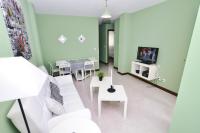 Televízia a/alebo spoločenská miestnosť v ubytovaní Ria de Ajo