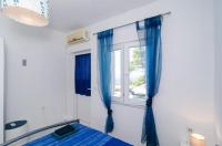 Posteľ alebo postele v izbe v ubytovaní Apartments Ammos