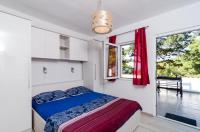 Posteľ alebo postele v izbe v ubytovaní Apartments Ammos