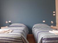 Posteľ alebo postele v izbe v ubytovaní Gardenia Guest House