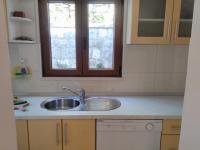 Kuchyňa alebo kuchynka v ubytovaní Sunny Apartments Mara