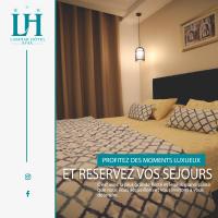 Postel nebo postele na pokoji v ubytování Larimar Hôtel Sfax