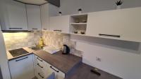 Kuchyňa alebo kuchynka v ubytovaní Gyulai-fürdő-apartman II.