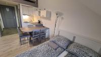 Posteľ alebo postele v izbe v ubytovaní Gyulai-fürdő-apartman II.
