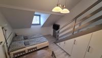 Posteľ alebo postele v izbe v ubytovaní Gyulai-fürdő-apartman II.